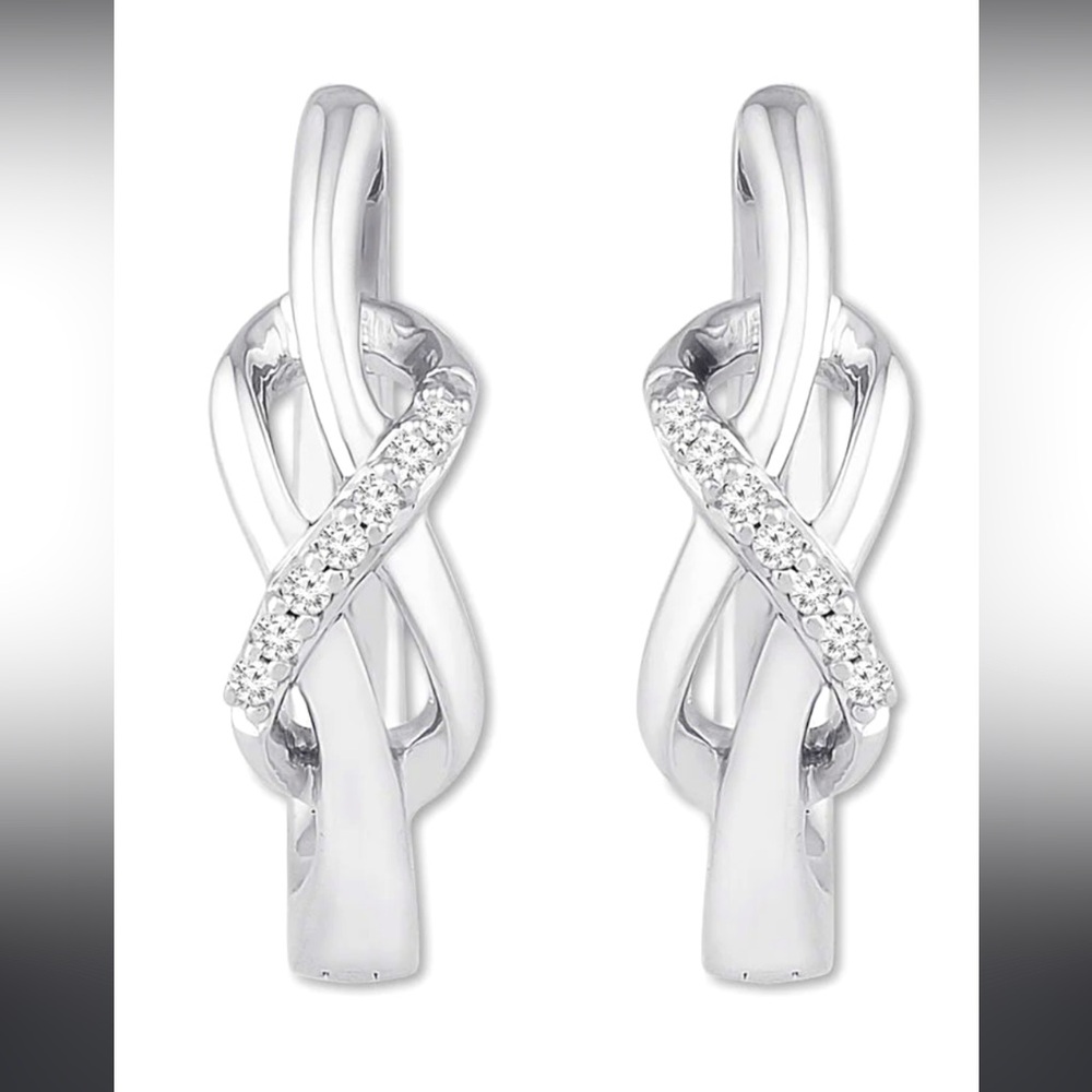 925 Silver With 10 genuine diamonds on each earring.